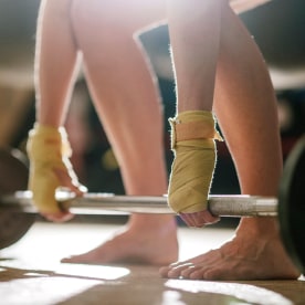 Boxer weight lifting barefoot.